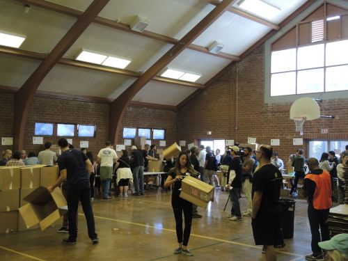 Volunteers of all ages helped to set up the assembly line, then fill the backpacks.