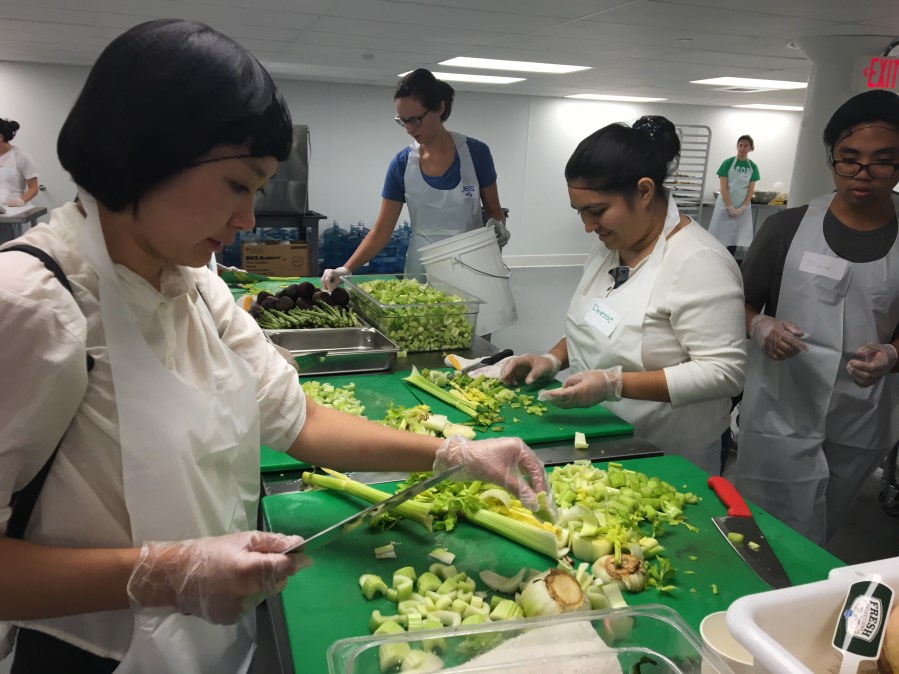 Chopping and sorting celery and asparagus at L.A. Kitchen with Penn Serves LA