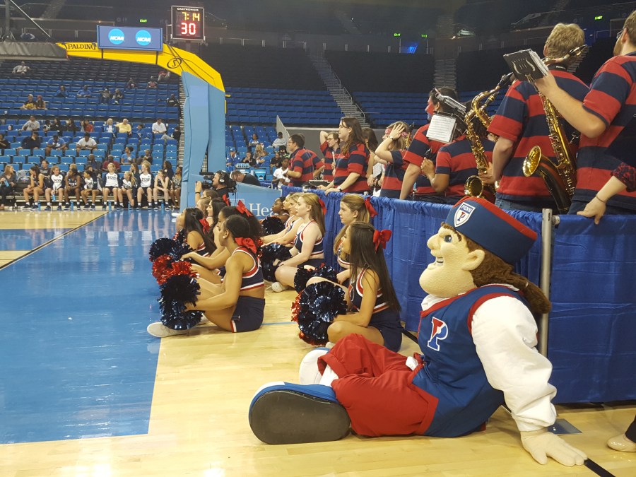 Penn Cheerleaders and the Quaker sit in front of the Penn Band during the game, photo credit Aileen Level, C'99, GED'00