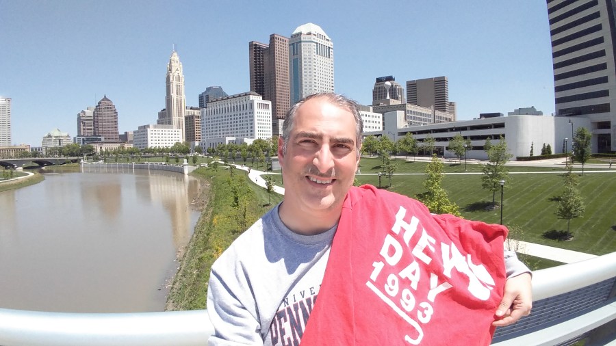 Ken MacFarlane, C'93, with the back of his Hey Day shirt.