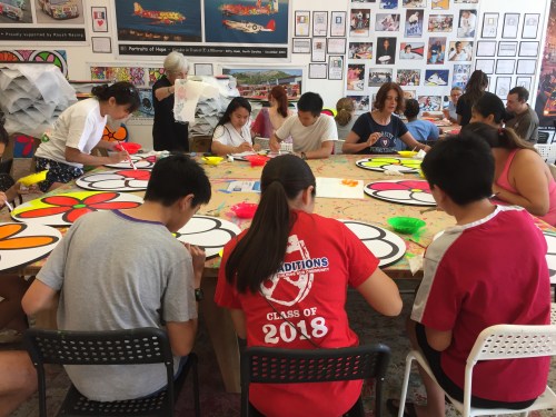 Penn Alumni and Penn Serves LA painting flowers at Portraits of Hope