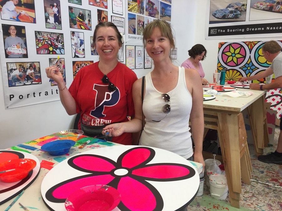 Penn Serves LA board members Kiera Reilly, C'93, and Jaime Kendall, W'04 paint a flower